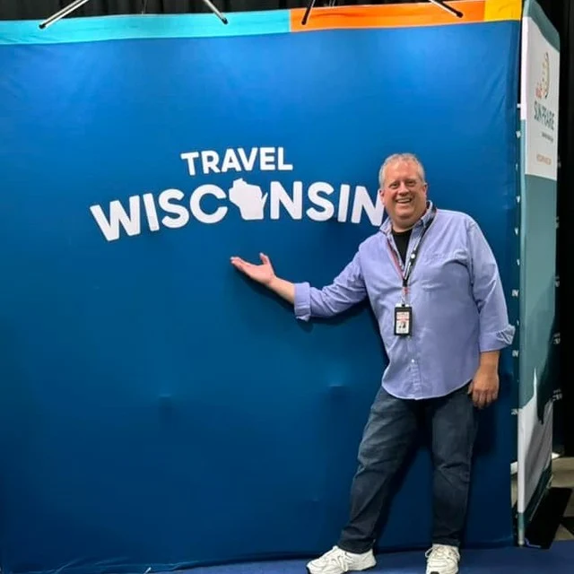 We had a lot of fun at the Travel Wisconsin booth at the Wisconsin State Fair this year, showcasing experiences and engaging in conversations with individuals interested in exploring what Washington County has to offer. Thank you to those who stopped by! 
If you visited us, we included a survey in our bags. The deadline is Aug. 15 to submit your responses to be entered in our drawing. We appreciate hearing about your experiences in Washington County.
We thank our volunteers Corinne, Pete and Connie for sharing their time at the booth. We appreciate Andrew Nussbaum, Tourism Development Specialist with Travel Wisconsin, for his help to make this happen.